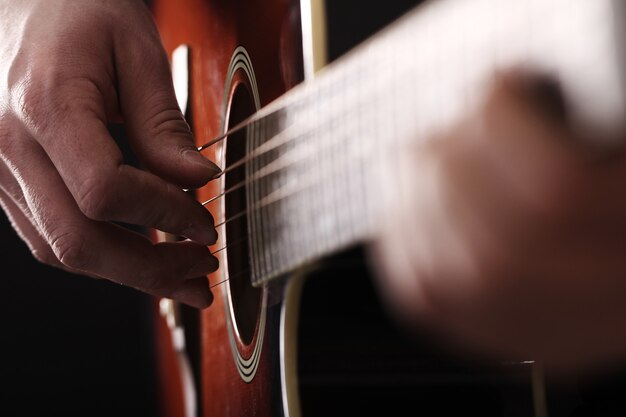 Musician playing on guitar