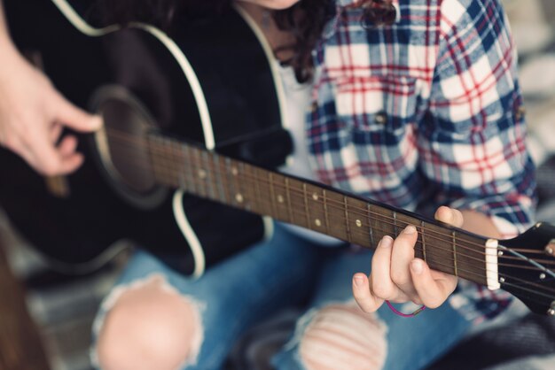 Musician playing on the guitar