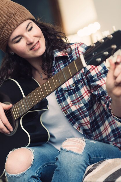 Musician playing on the guitar