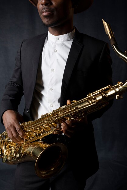 Musician in suit holding saxophone