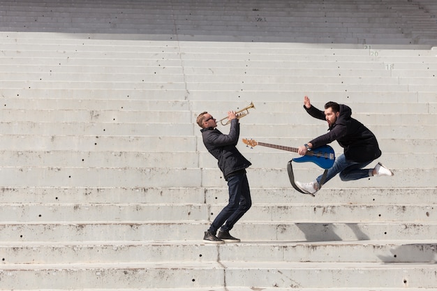 Musicians performing and jumping