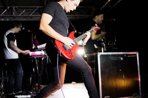 musicians on stage during a concert