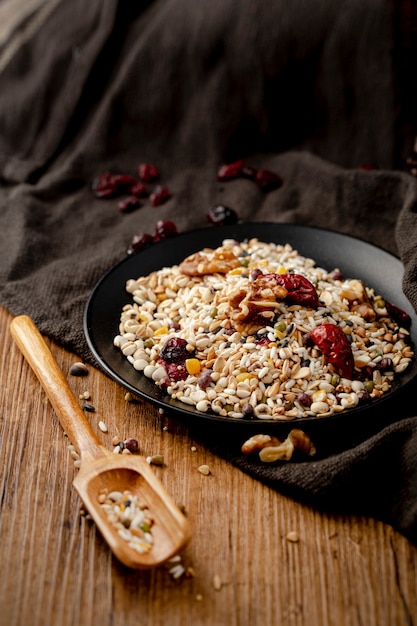 Musli in a black plate on a black cloth