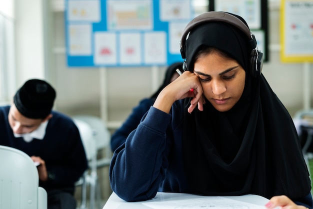 Muslim children studying in classroom