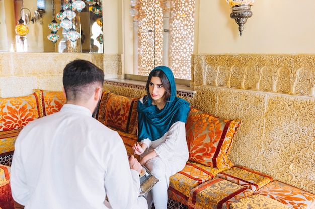 Muslim couple in arab restaurant