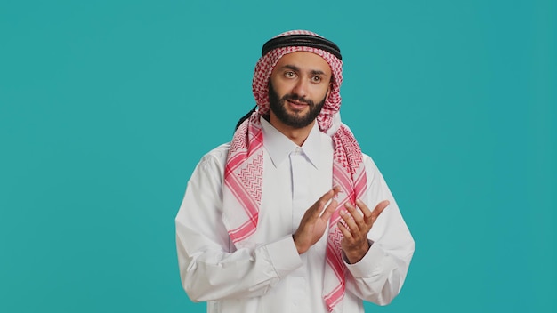 Free photo muslim guy showcasing proud expression