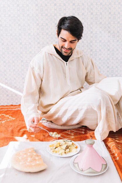 Muslim man eating