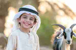 Free photo muslim people with photorealistic animals prepared for the eid al-adha offering