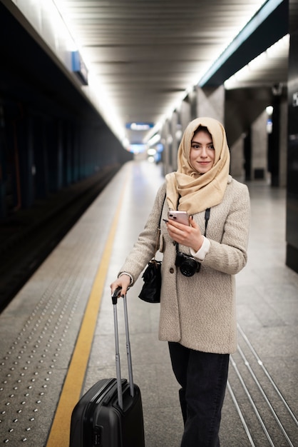 Muslim person travelling through the city