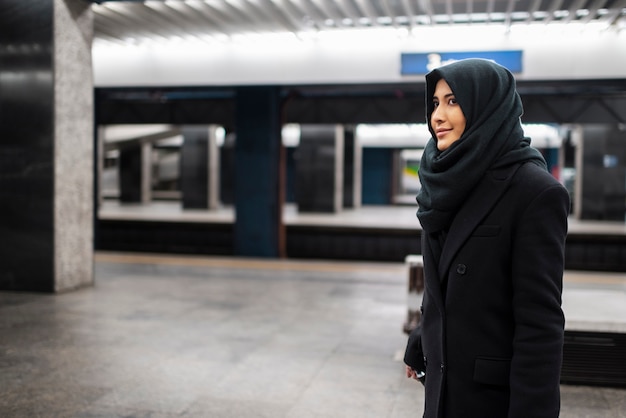 Muslim person travelling through the city