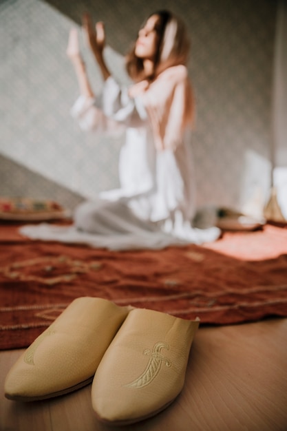 Muslim woman in background praying