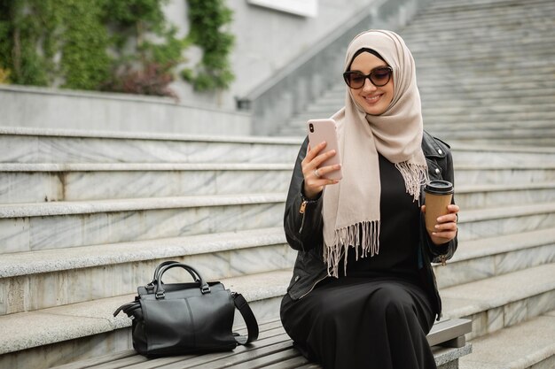 Muslim woman in hijab in city street