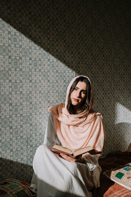 Muslim woman reading in quran