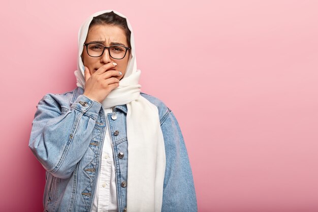 Muslim woman wearing denim jacket