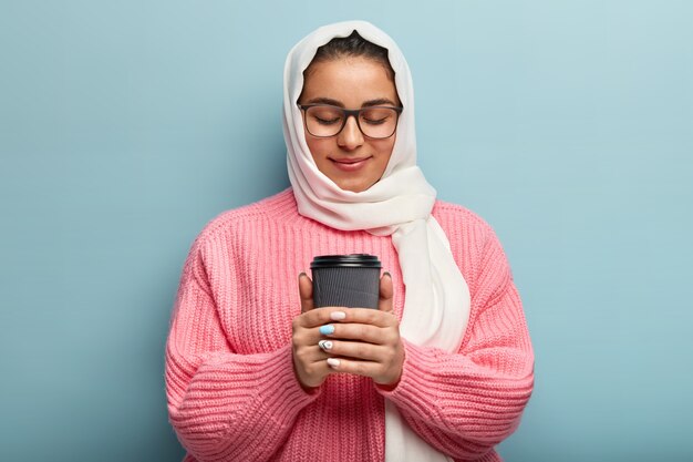 Muslim woman wearing pink sweater