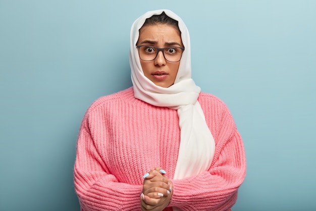Muslim woman wearing pink sweater