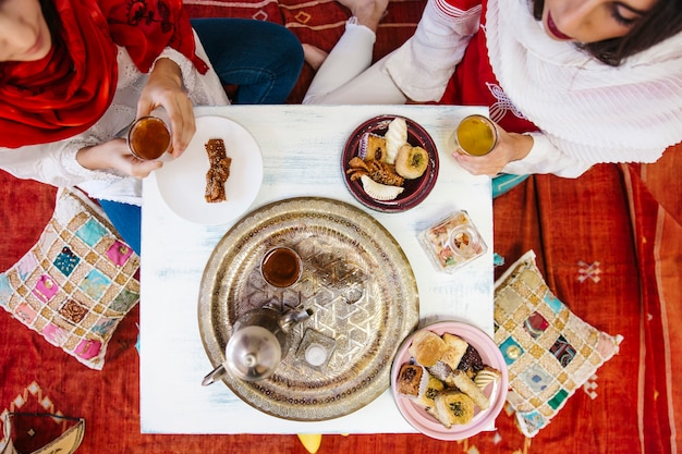 Muslim women drinking tea