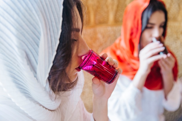 Muslim women drinking tea