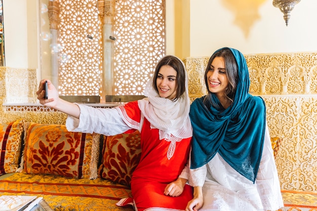 Muslim women taking selfie