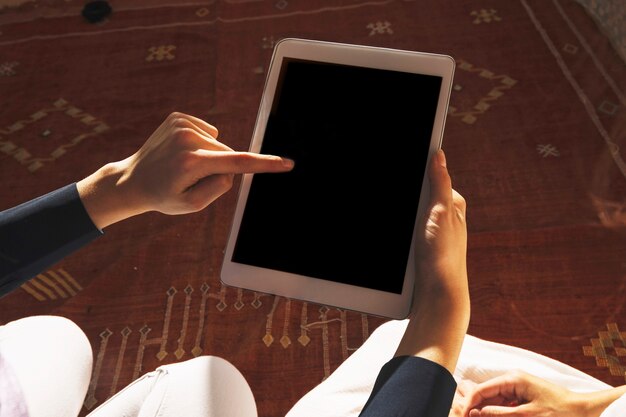 Muslim women using tablet