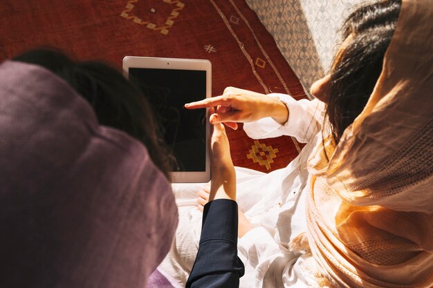 Muslim women using tablet