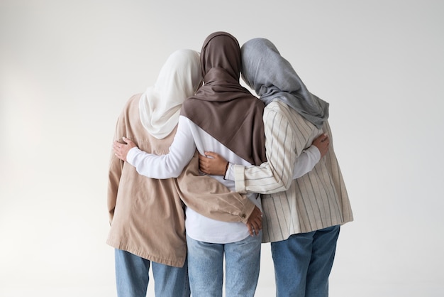 Free photo muslim women wearing hijabs medium shot