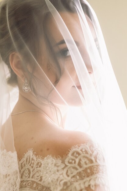 Mysterious portrait of a bride hidden under the veil