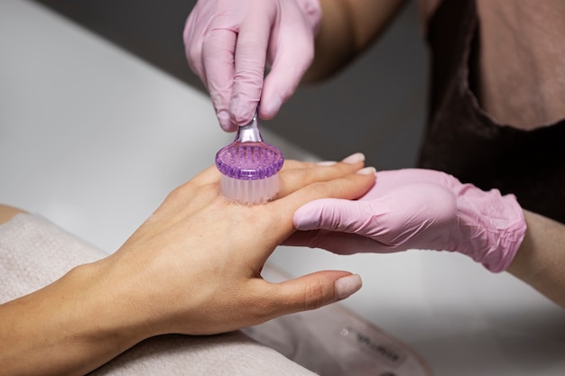 Nail art professional working on client nails