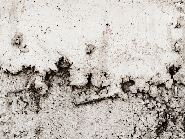 Nail stuck in weathered wall