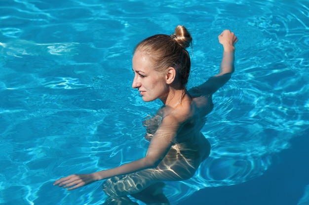 Naked Woman Swimming In Water