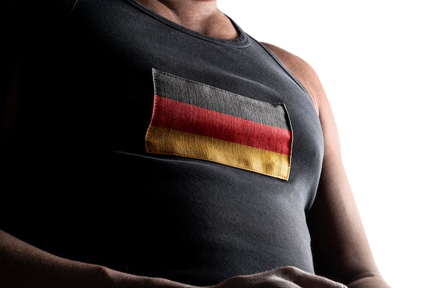 The national flag of Germany on the athlete's chest.