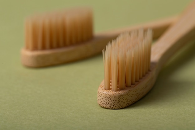 Natural bambu brushes on green background