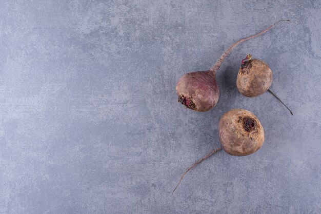 Natural beetroots isolated on blue concrete surface
