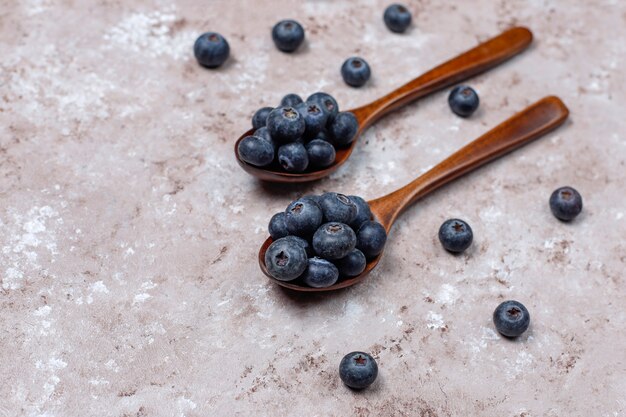Natural blueberries on light brown surface,copy space