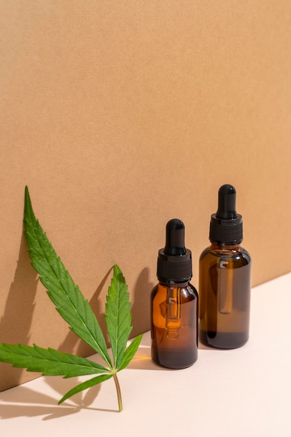 Free photo natural cannabis oil bottle arrangement