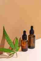 Free photo natural cannabis oil bottle arrangement