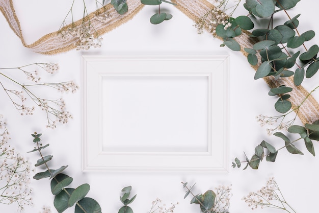 Free photo natural decoration with ribbon and a frame