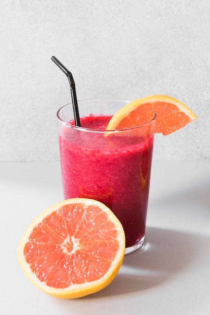 Free photo natural grapefruit smoothie in bottle