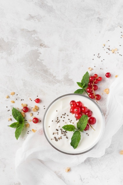 Natural healthy dessert in transparent glass copy space