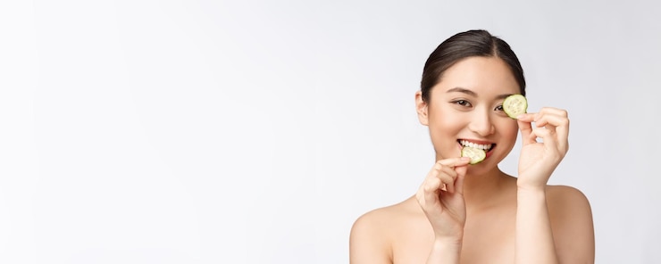 Free Photo natural homemade fresh cucumber facial eye pads facial masks asian woman holding cucumber pads and smile relax with natural homemade