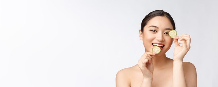 Free Photo natural homemade fresh cucumber facial eye pads facial masks asian woman holding cucumber pads and smile relax with natural homemade