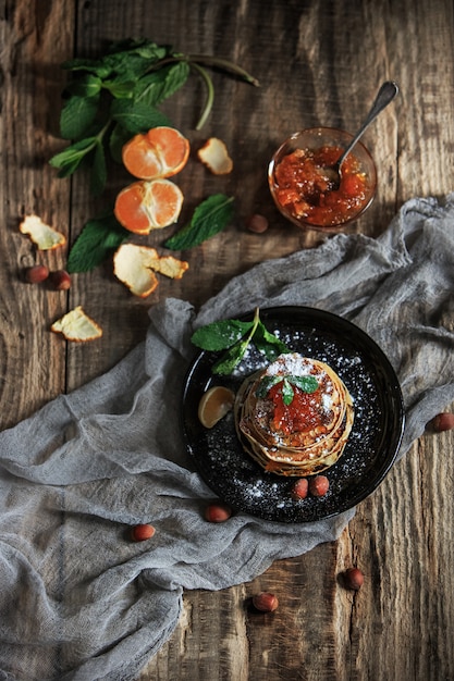 Natural mandarin jam on wooden table