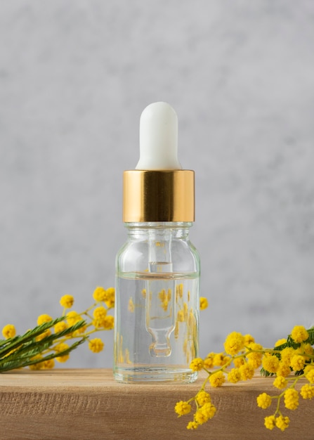 Free photo natural medicine concept with serum and plant