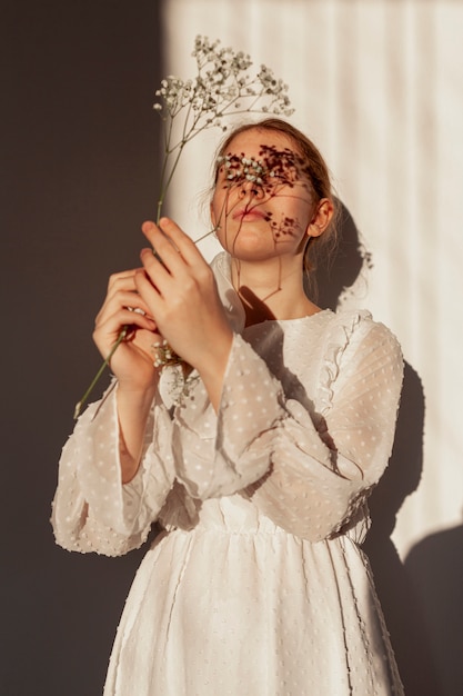 Natural model holding flower