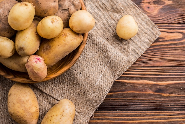 Natural potatoes on bowl with copy-space