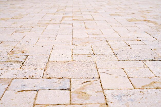 Natural sandstone paving slabs, selective focus. Natural natural stone for interior and renovation. Arrangement of sidewalks and roads