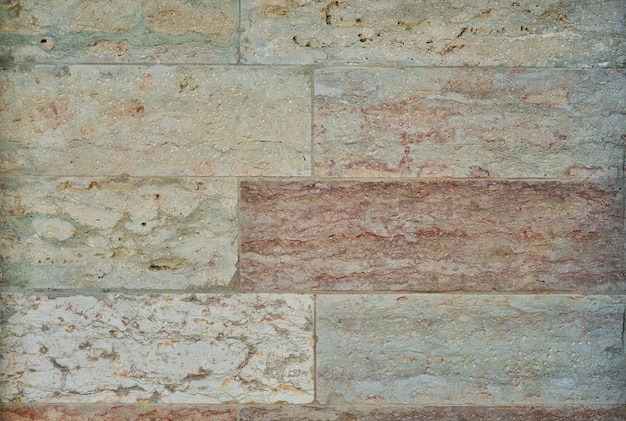 自然な砂岩の壁の背景または壁紙のテクスチャ家または建物のデザインと内部空間のファサードの壁の石積み