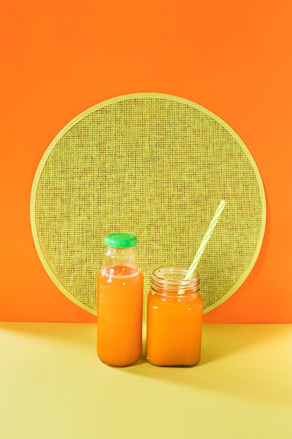 Natural smoothie in bottle with straw