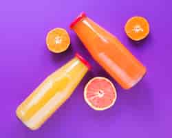 Free photo natural smoothie of orange and grapefruit
