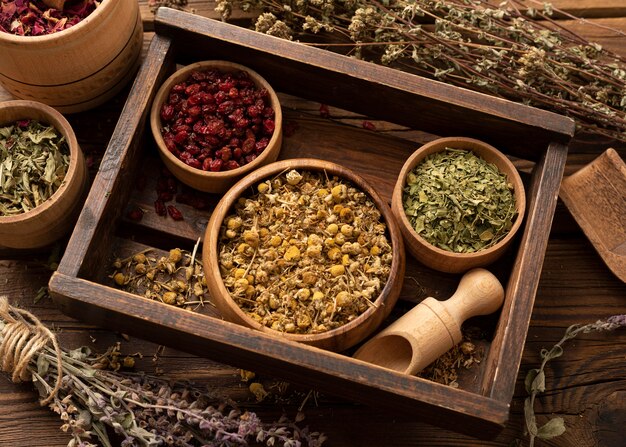 Natural various herbs in a wooden box high view